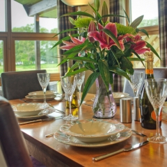 A table set for dining  in a chalet at Loch Lomond Waterfront