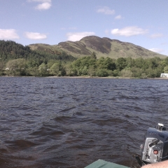 A boat with a view over Loch Lomond & Conic Hill
