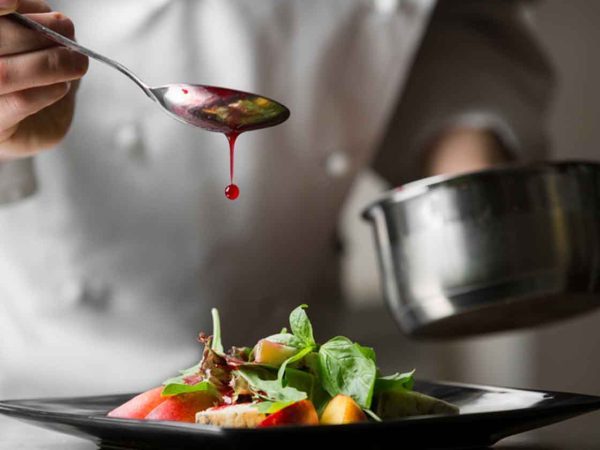 A chef preparing a dish.