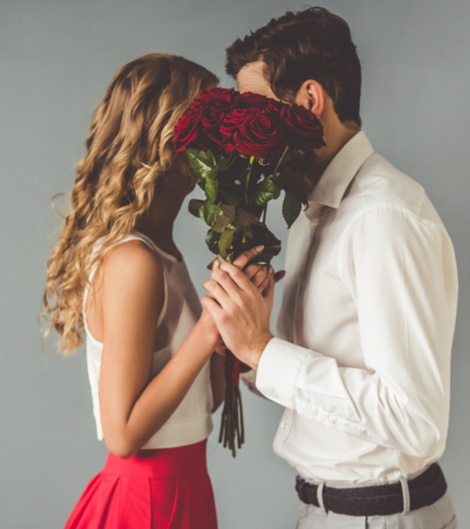 Couple with roses kissing
