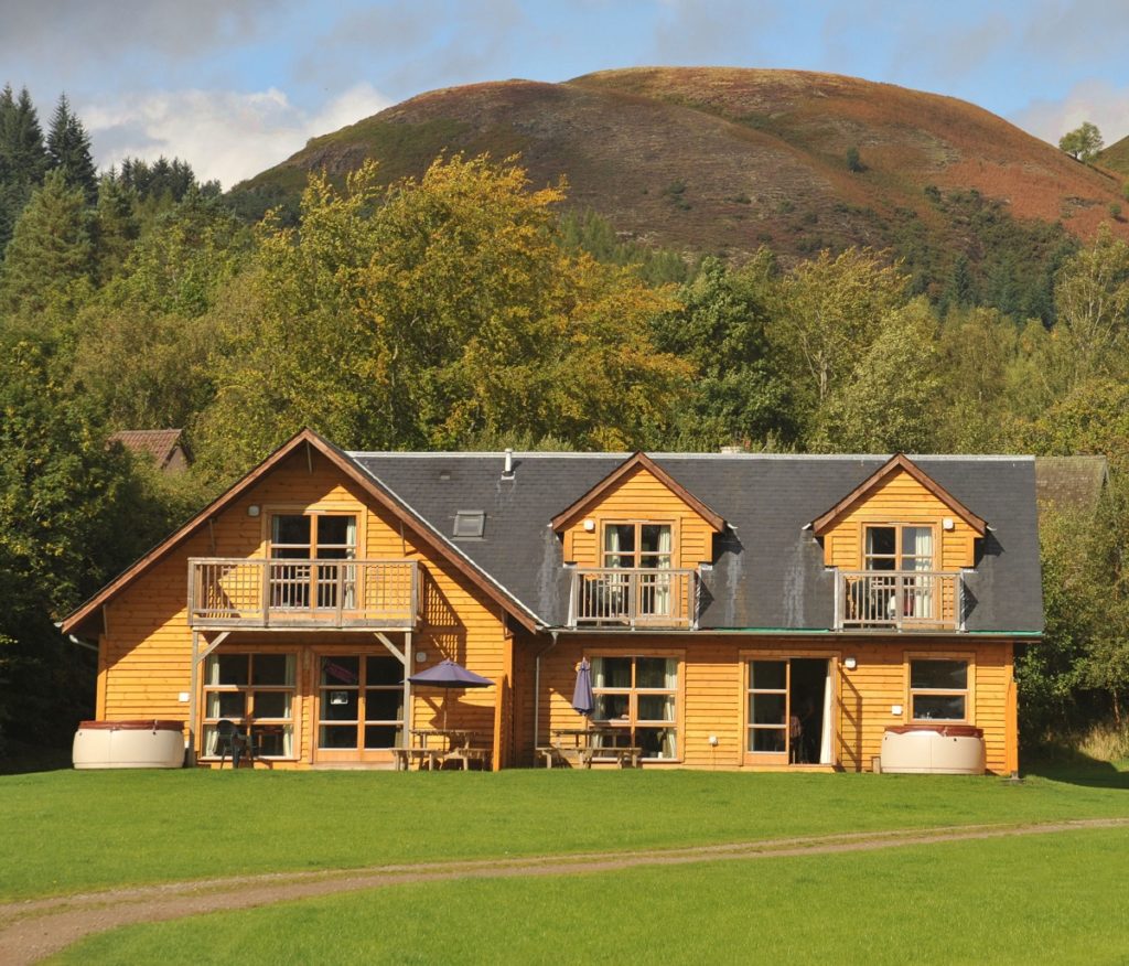 The exterior of a lodge at Loch Lomond Waterfront