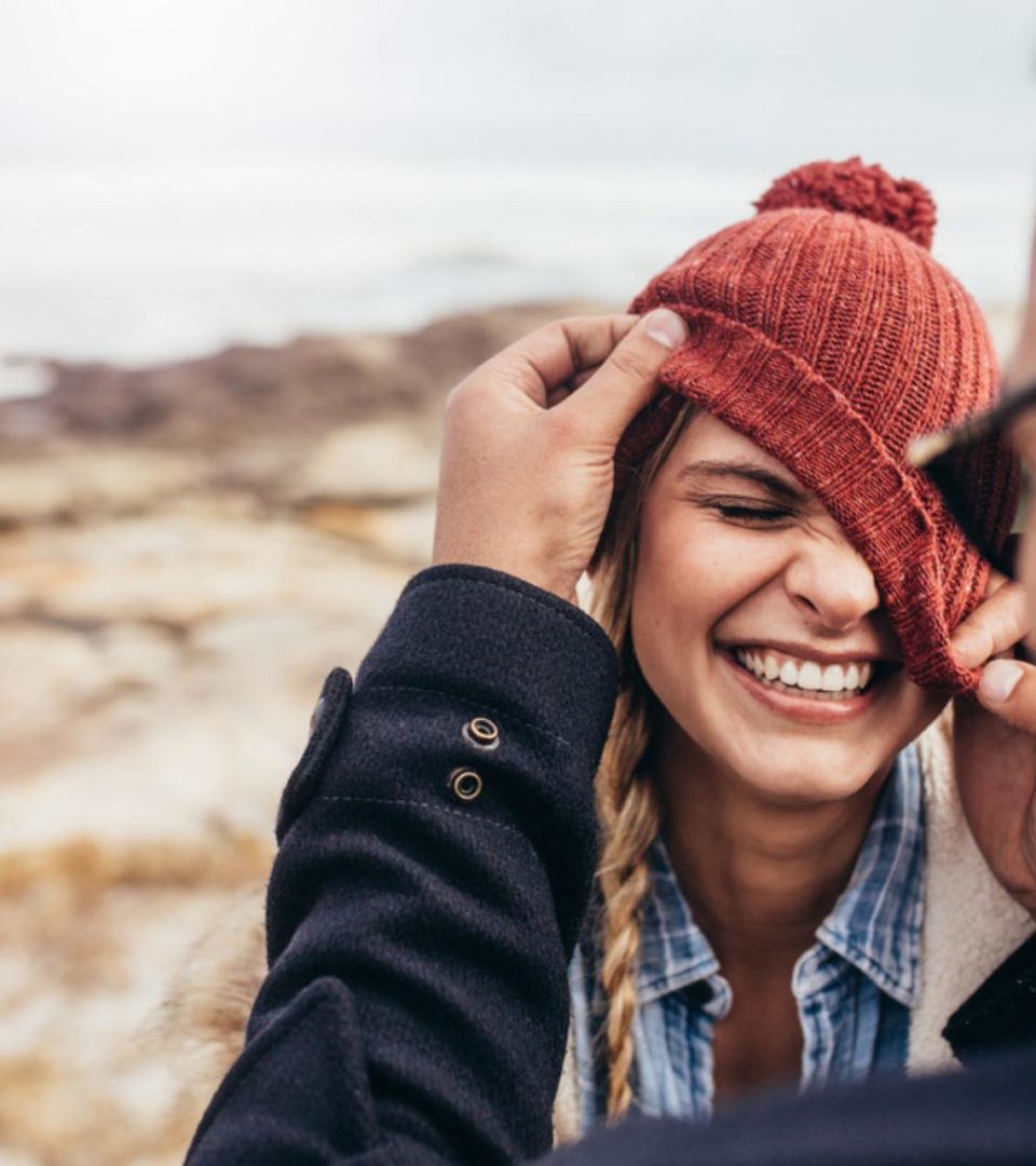 Couple enjoying a winter walk and laughing together