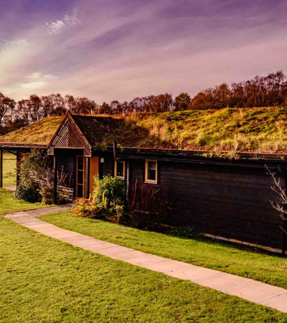 A Loch Lomond Waterfront lodge with dramatic sky scenery