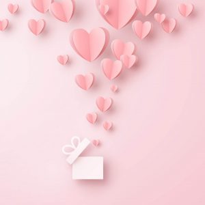 A gift box with paper love hearts coming out of it