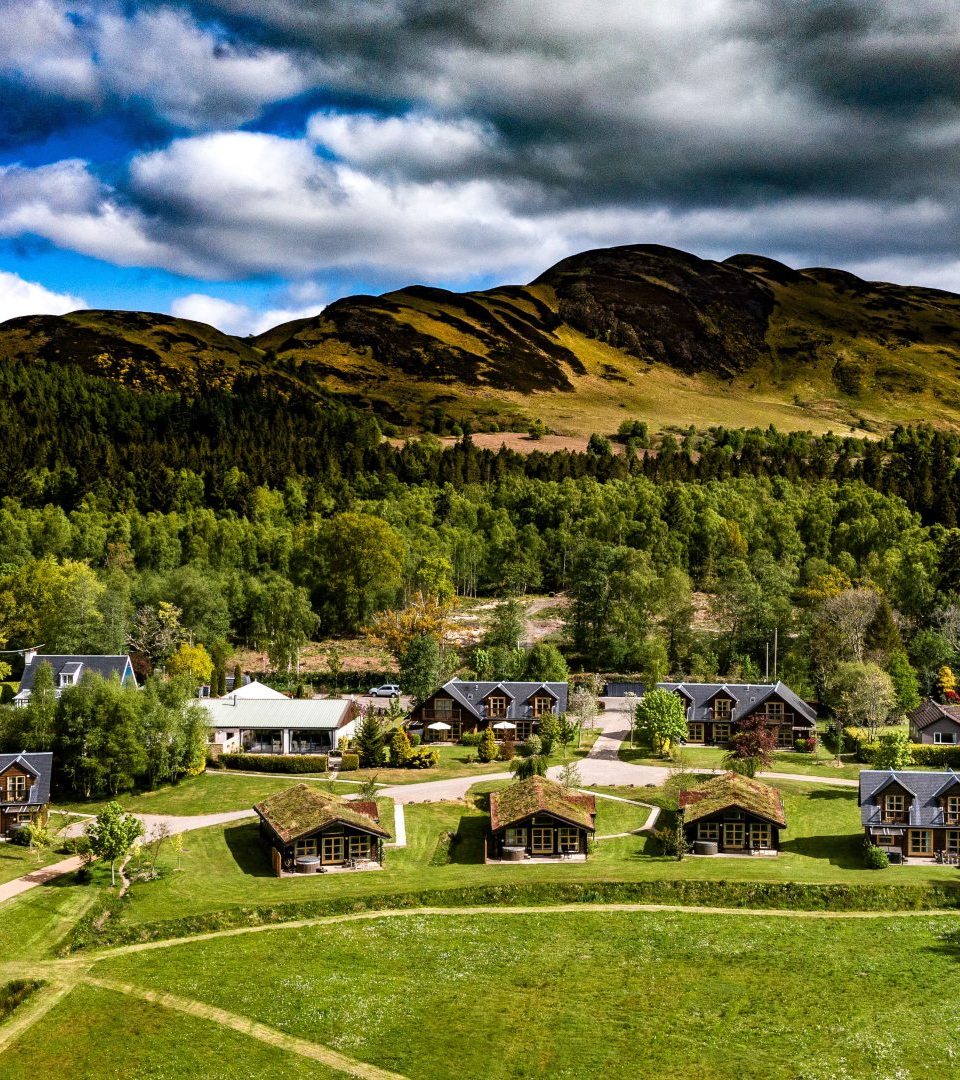 Loch Lomond Waterfront luxury wedding resort drone photo of the grounds with Conic Hill behind