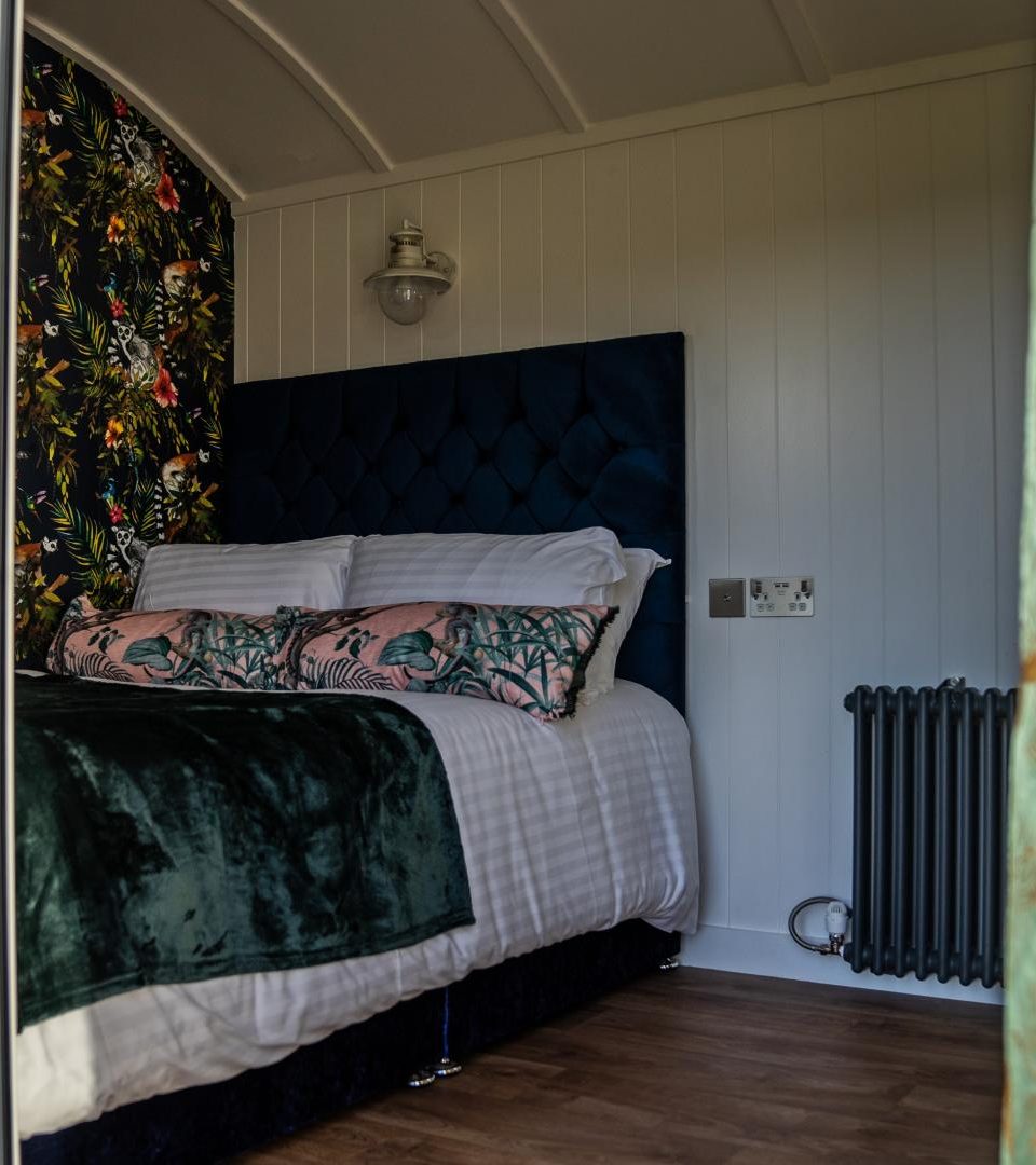 A boutique bedroom in one of our luxury glamping pods