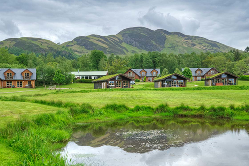 A view of holiday lodges at Loch Lomond Waterfront