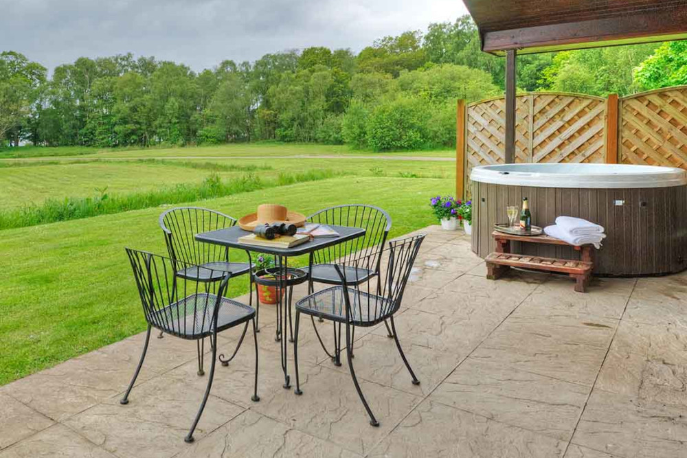 A hot tub on a patio at Loch Lomond Waterfront