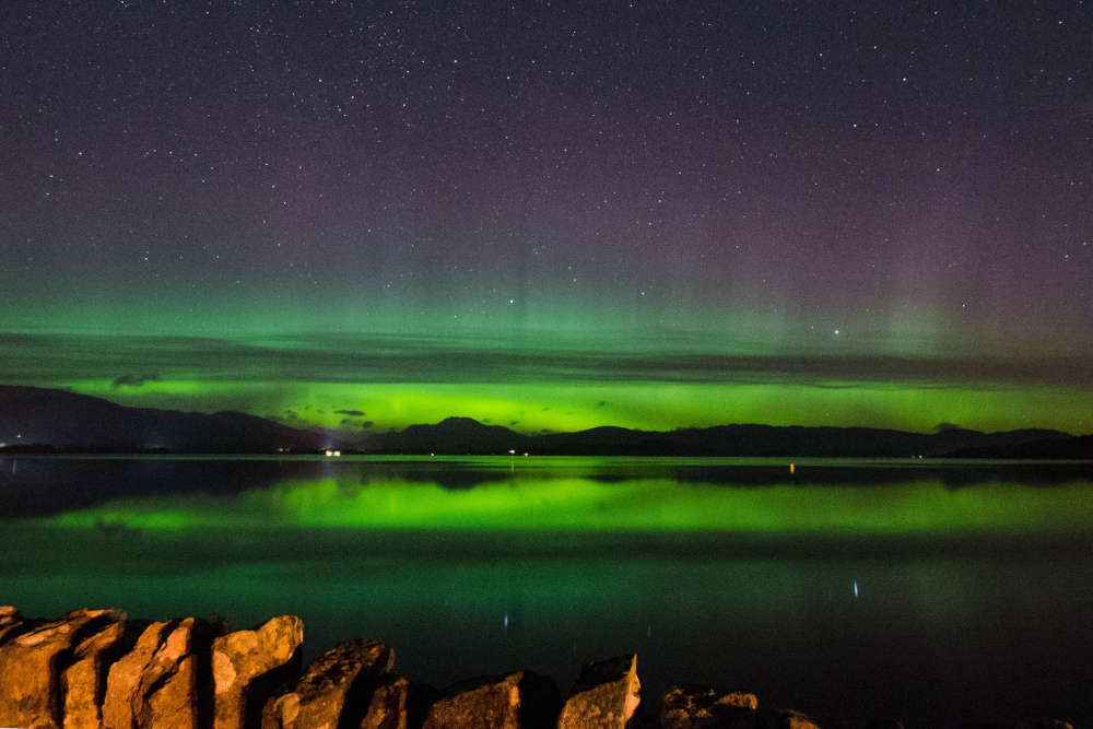 The Aurora Borealis over Loch Lomond in Scotland