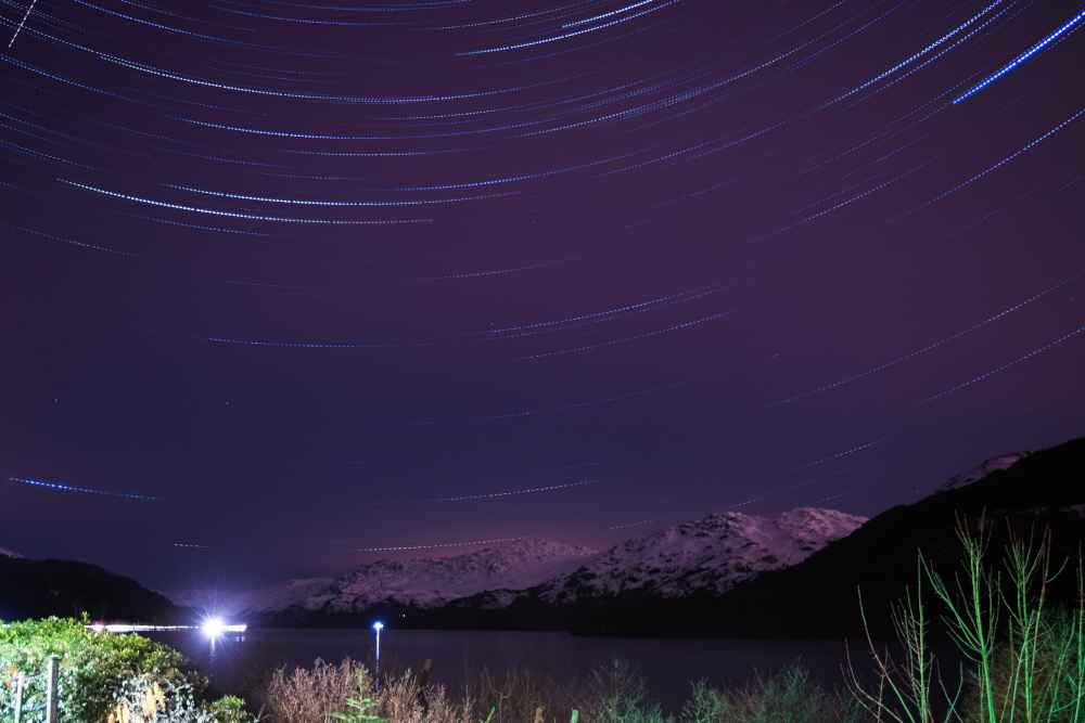 Long exposure photograph showing the stars over Loch Lomond 