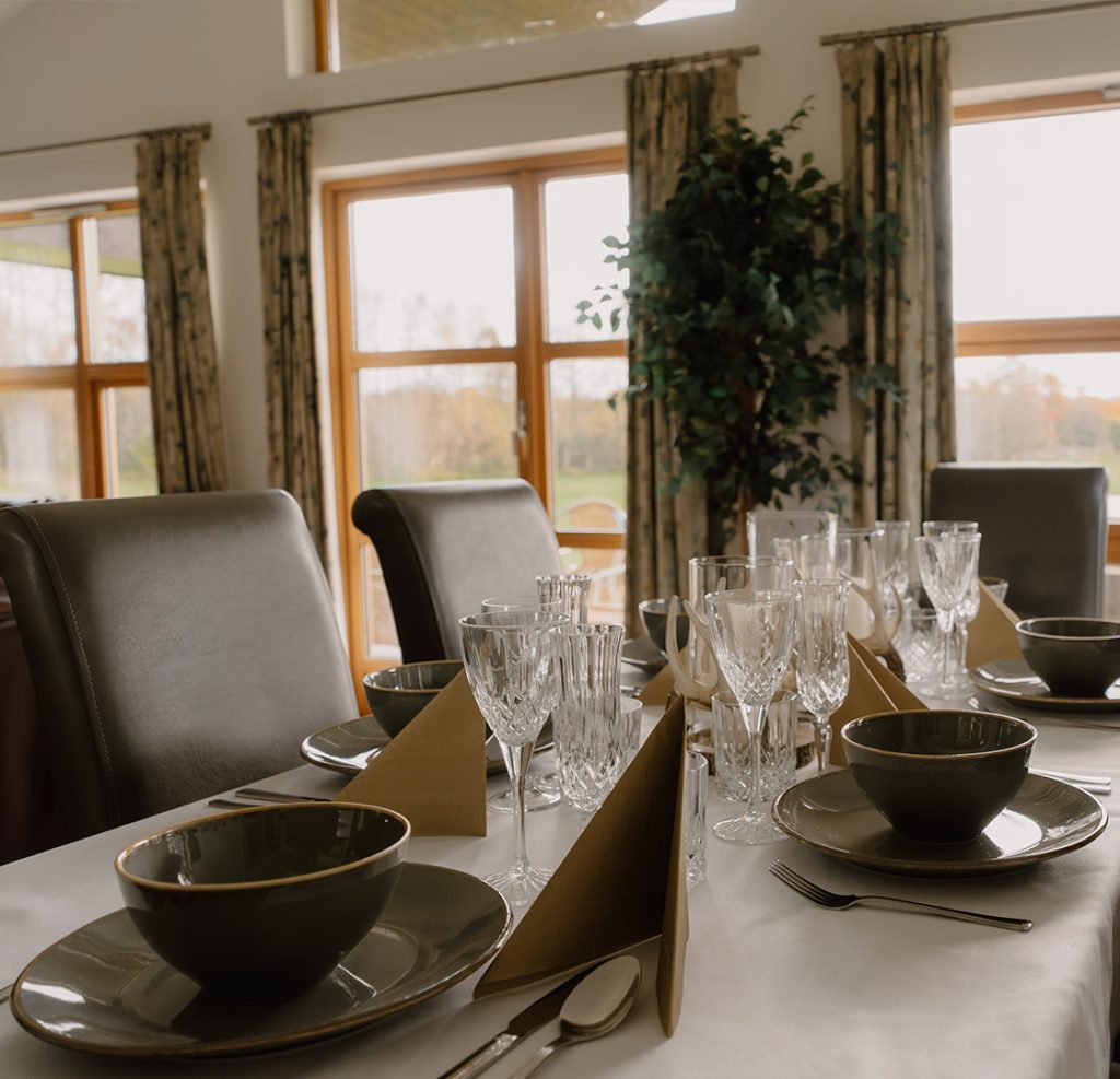 Details of s set dining table in a chalet at Loch Lomond Waterfront luxury lodges in Balmaha