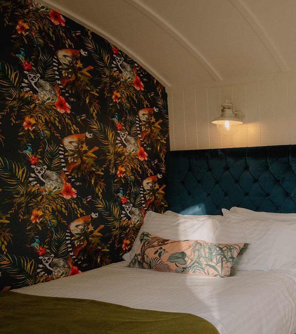 A cosy bed in a Shepherd's Hut at Loch Lomond Waterfront luxury lodges in Balmaha