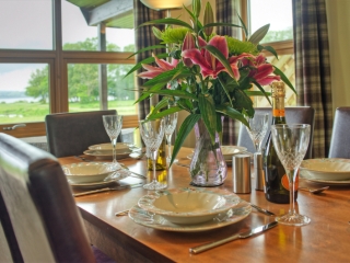 A table set for dining  in a chalet at Loch Lomond Waterfront