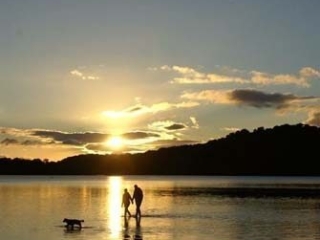 People on the beach at Loch Lomond Waterfront