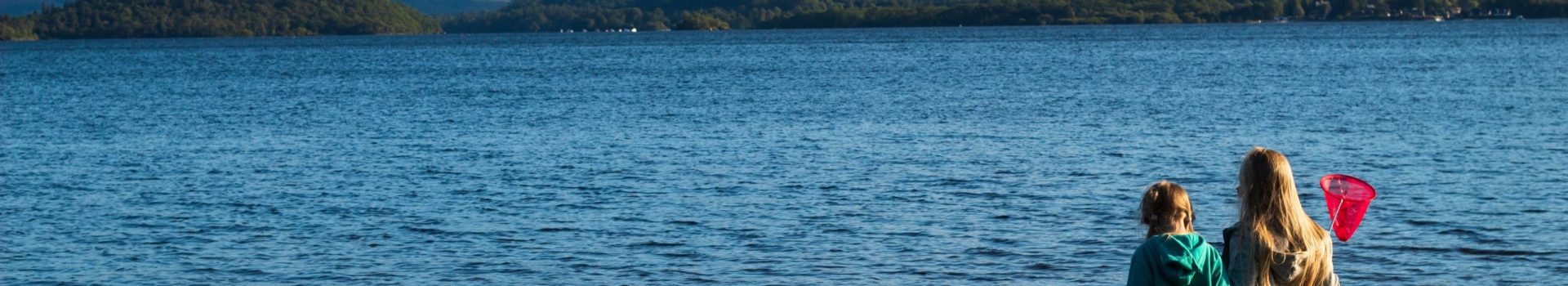 Children having fun playing on Loch Lomond Beech.