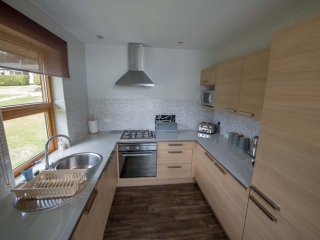 A kitchen in a chalet at Loch Lomond Waterfront