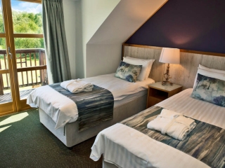 A twin bedroom in a lodge at Loch Lomond Waterfront A twin bedroom in a lodge at Loch Lomond Waterfront