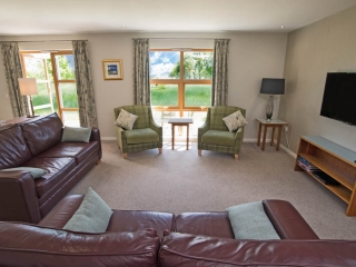 A lounge in a lodge at Loch Lomond Waterfront A lounge in a lodge at Loch Lomond Waterfront