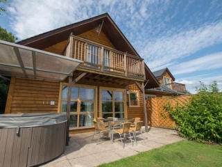 A lodge and its hot tub at Loch Lomond Waterfront A lodge and its hot tub at Loch Lomond Waterfront