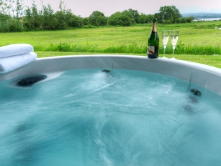 A hot tub outside a lodge at Loch Lomond Waterfront A hot tub outside a lodge at Loch Lomond Waterfront