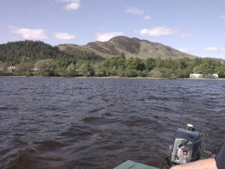 A boat with a view over Loch Lomond &amp; Conic Hill