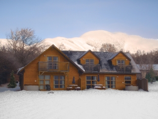 A lodge at Loch Lomond Waterfront in the snow