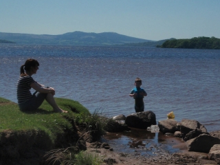 People on the beach at Loch Lomond Waterfront