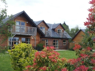 Lodges in the summer at Loch Lomond Waterfront Lodges in the summer at Loch Lomond Waterfront