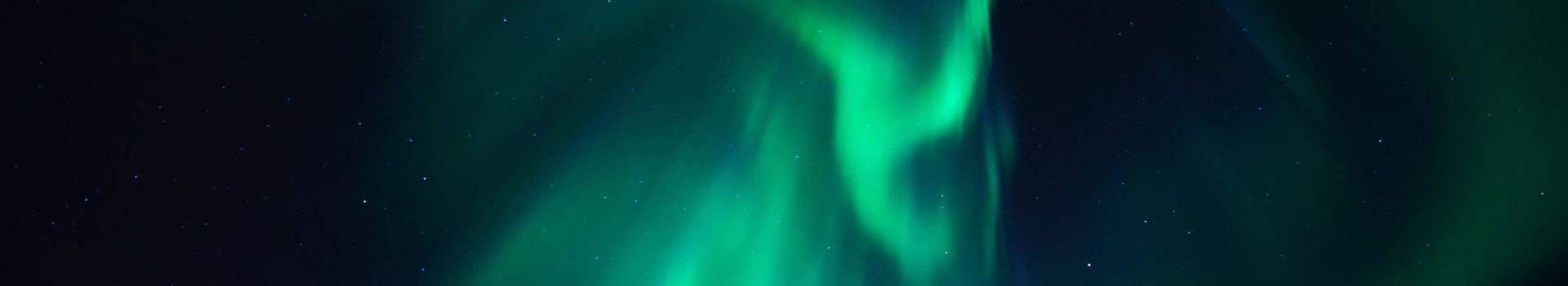 The Northern Lights over the Scottish Highlands.