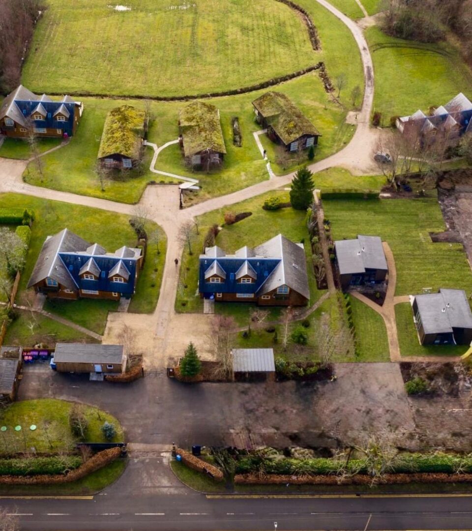 A drone shot of Loch Lomond Waterfront lodges, challets, studio lodges and glamping pods.