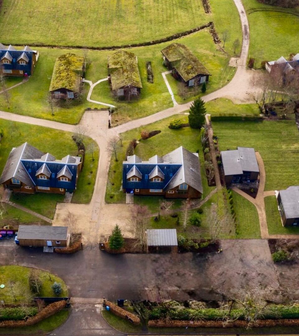A drone shot of Loch Lomond Waterfront lodges, challets, studio lodges and glamping pods.