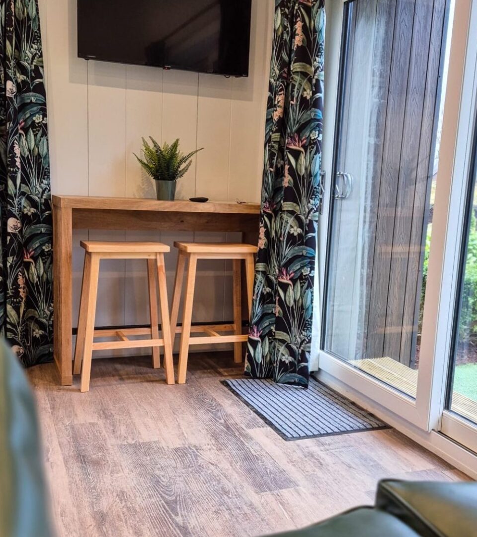 Studio Lodges accommodation dining table in the living area for your holidays by Loch Lomond.