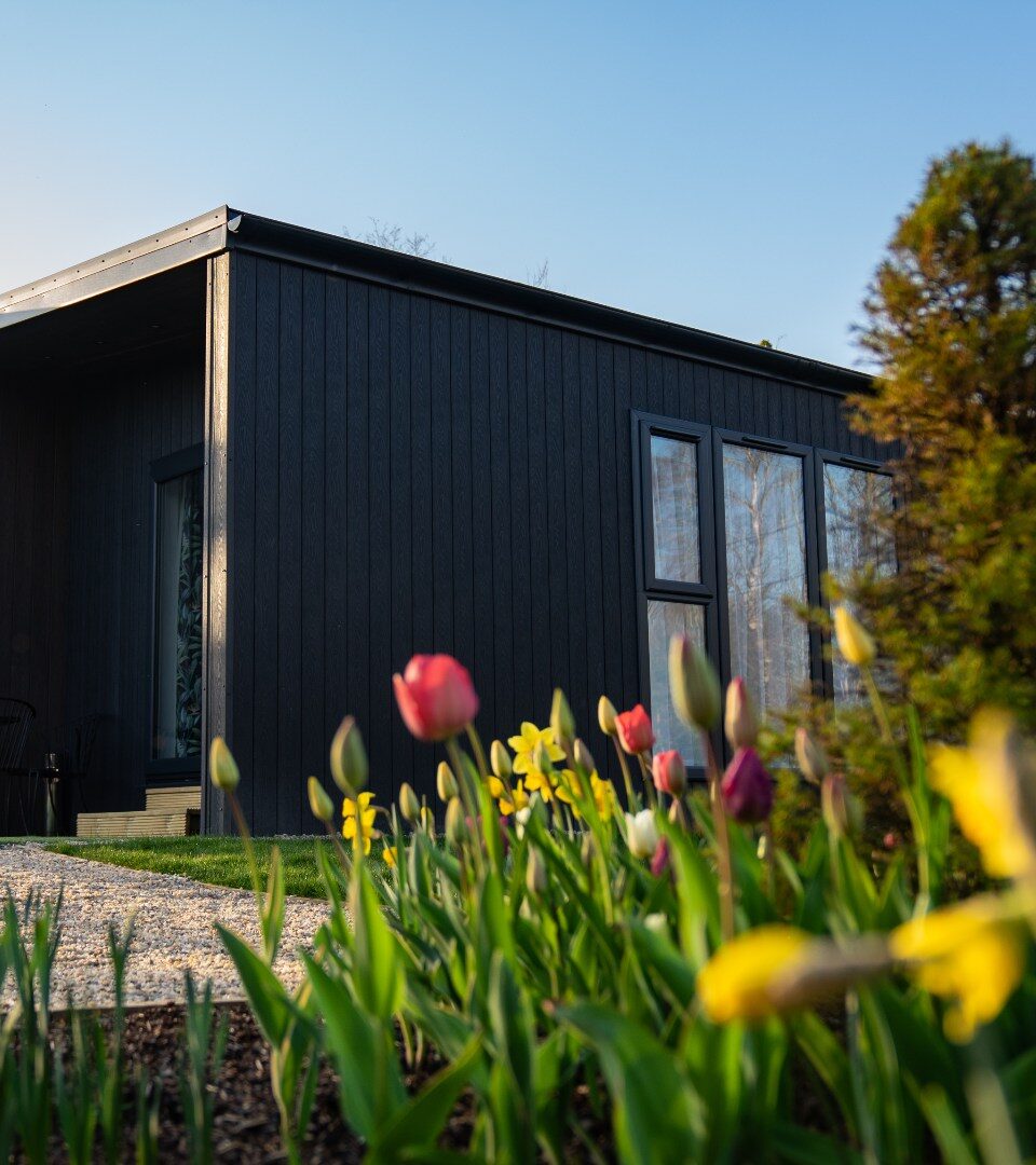 An exterior photo of our luxury studio lodges overlooking Loch Lomond in Spring.