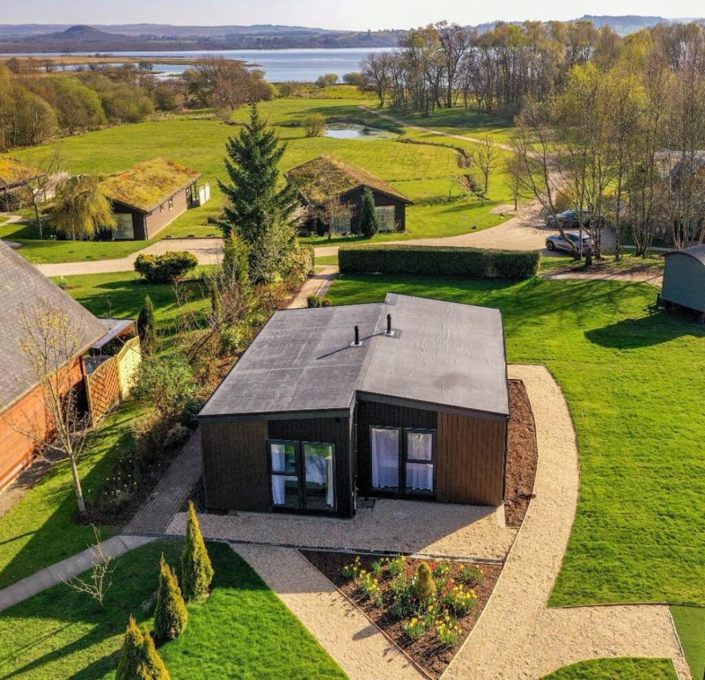 A drone view of our luxury studio lodges overlooking Loch Lomond.