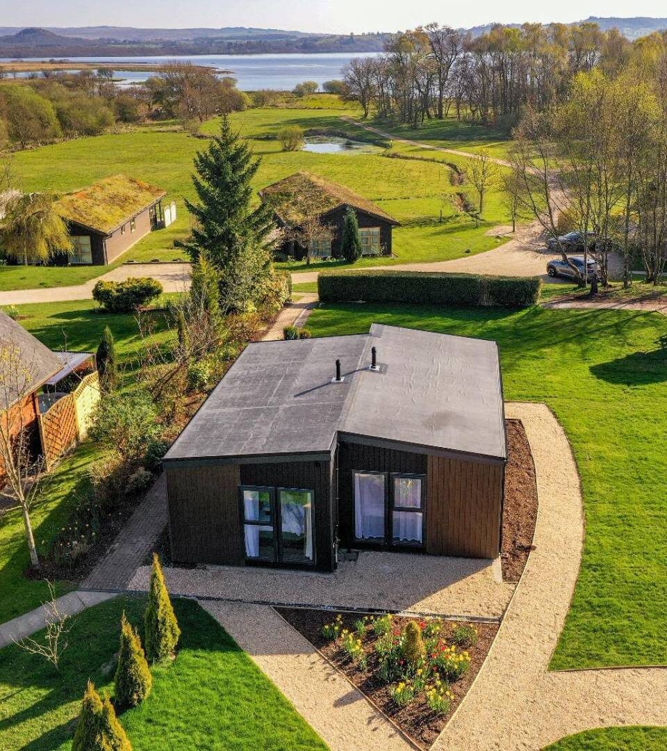 A drone view of our luxury studio lodges overlooking Loch Lomond.