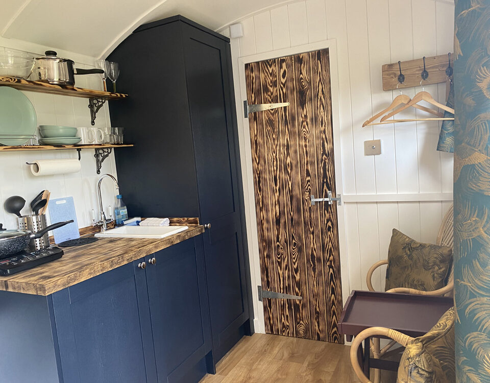 The kitchen in a Shepherd&#039;s Hut at Loch Lomond Waterfront