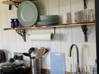The kitchen and utensils in a Shepherd&#039;s Hut at Loch Lomond