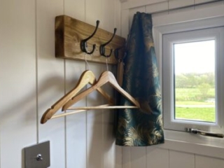 Hooks for hanging clothes in a Shepherd&#039;s Hut at Loch Lomond