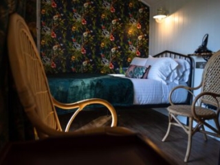 The sleeping and sitting area in a Shepherd&#039;s Hut at Loch Lomond Waterfront