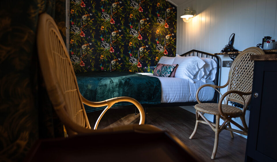 The sleeping and sitting area in a Shepherd&#039;s Hut at Loch Lomond Waterfront