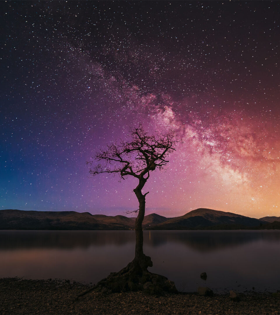 Starry sky over Loch Lomond in Scotland