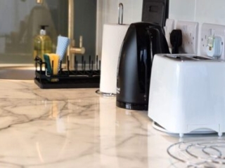 Kitchen worktop and utensils in a Studio Lodge at Loch Lomond Waterfront