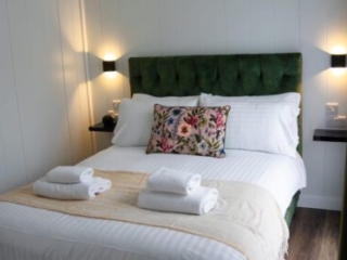 A double bed in a Studio Lodge at Loch Lomond Waterfront