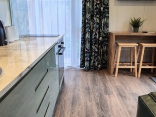 The open plan living area in a Studio Lodge at Loch Lomond Waterfront