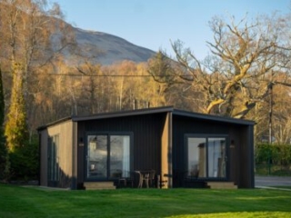 A Studio Lodge at Loch Lomond Waterfront with Conic Hill in the background