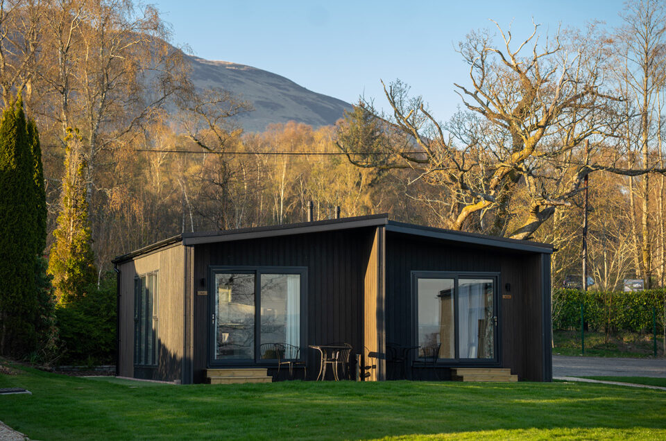 A Studio Lodge at Loch Lomond Waterfront with Conic Hill in the background