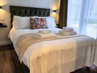 The double bed in a Studio Lodge at Loch Lomond Waterfront
