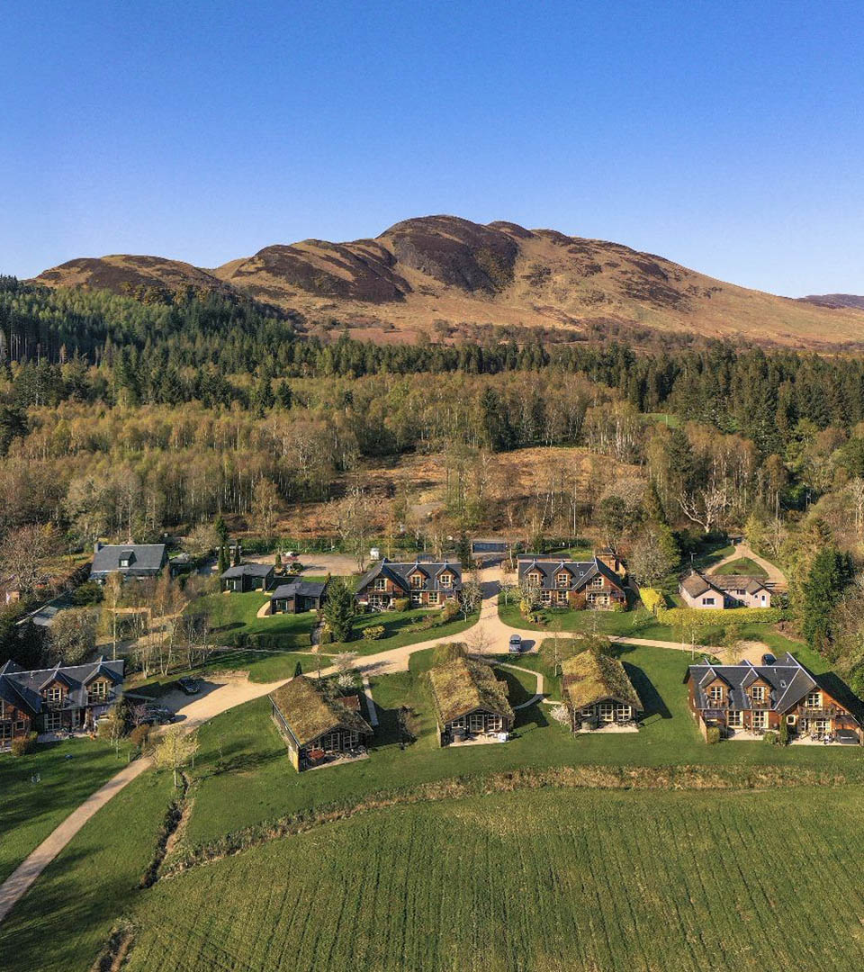 The stunning resort of Loch Lomond Waterfront with the iconic Conic Hill in the background