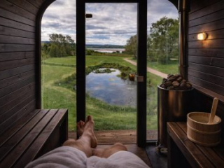 Loch Lomond wilderness wellness sauna view over our pond and the waters shores.