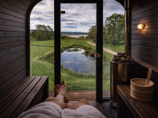 Loch Lomond wilderness wellness sauna view over our pond and the waters shores.